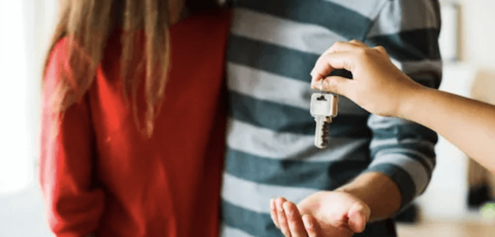 Couple getting keys to home